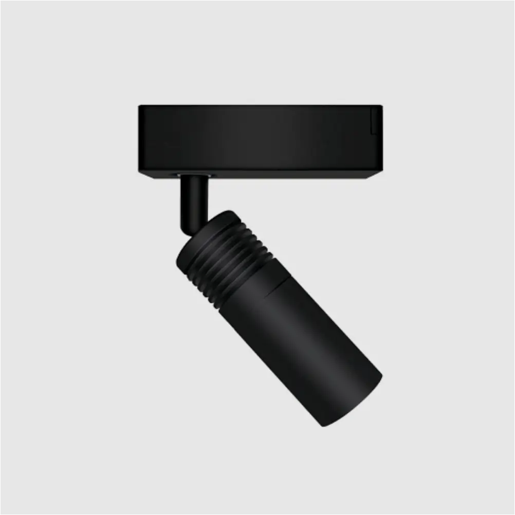 Black Mini Beam track-mounted gobo projector with ribbed barrel tilted on its rotating ball joint