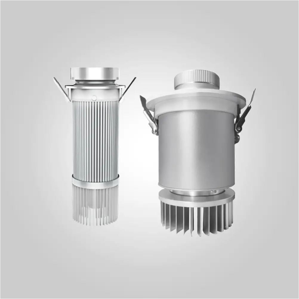Two silver embedded gobo projector models side by side, slim and wide recessed bodies with finned cooling bases