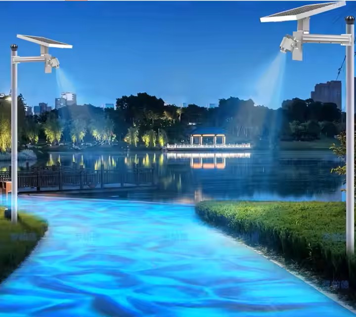 Composite night scene of pole-mounted solar projectors casting blue water-effect light on a park path