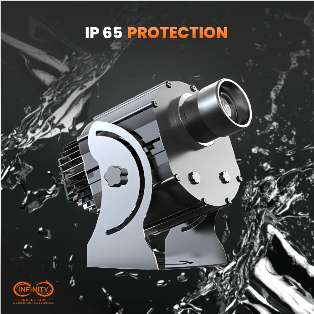Silver IP65 waterproof gobo projector amid water splashes on a dark background