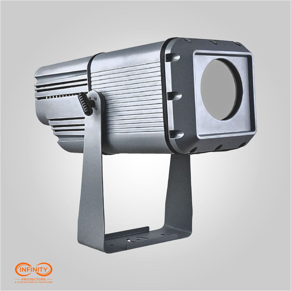 Side view of the high-wattage zoom gobo projector in silver with square lens hood and steel mounting yoke