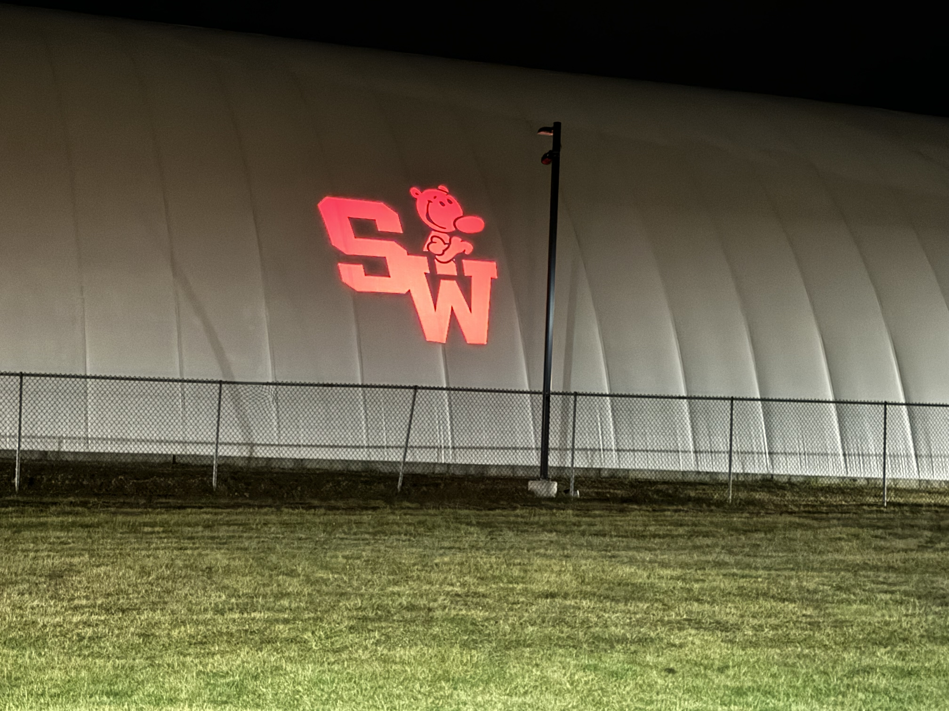 Real photo of S&W logo projected on dome tent wall