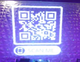 Video: giant QR code with scan-me label projected on a faceted club wall