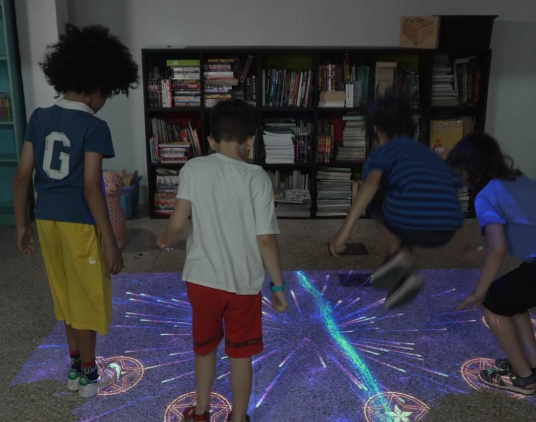 Video: kids jump on star targets as cosmic fireworks burst across an interactive floor