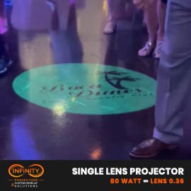 Video: teal country club logo projected onto a busy dance floor as party guests mingle — Infinity Projectors