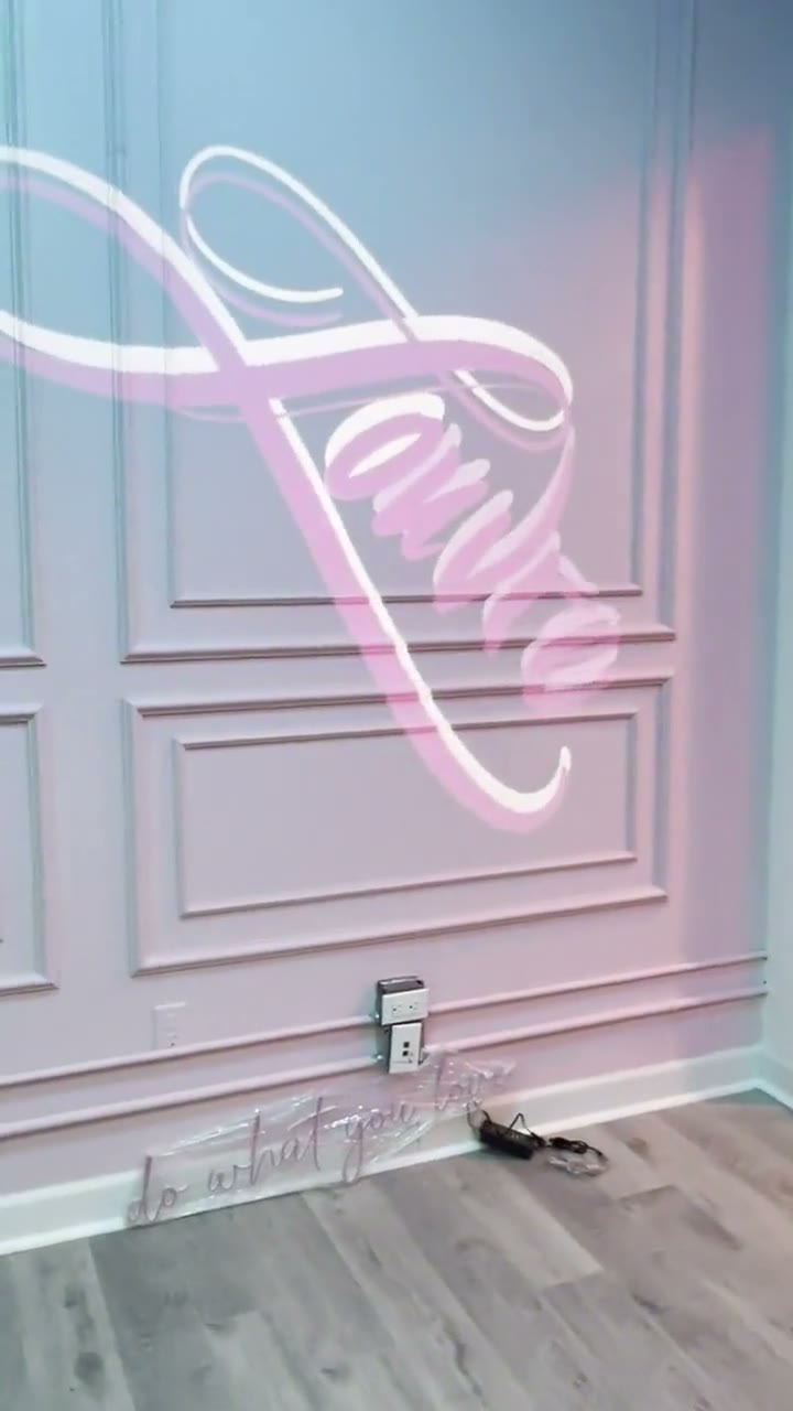 Elegant script gobo projection on an event venue wall — custom monogram-style wedding and event lighting — Infinity Projectors