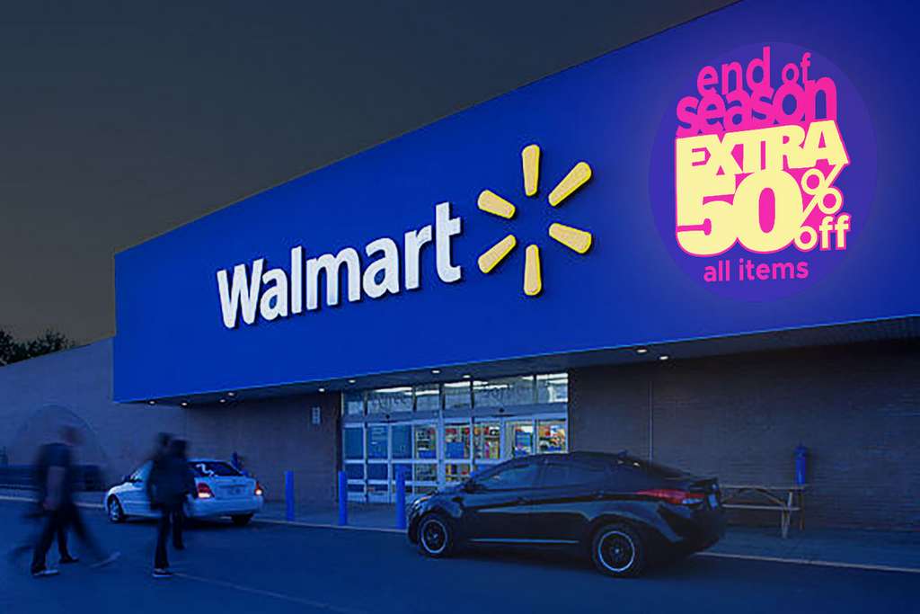 End-of-season 50% off promo projected beside a big-box store's storefront sign at night — Infinity Projectors