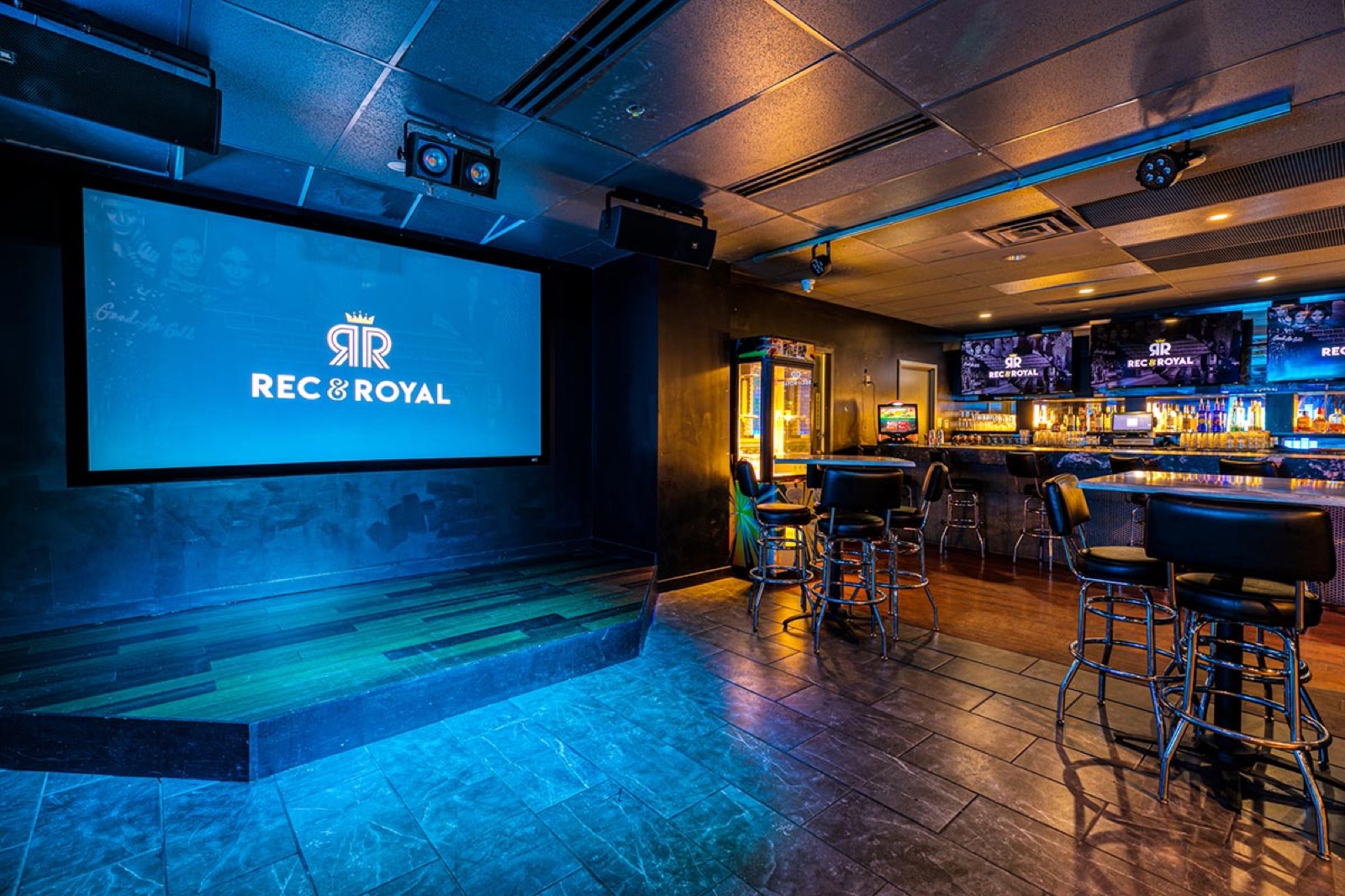 Rec Room Bar Stage logo gobo projection — real Restaurants & Bars install | Infinity Projectors — Infinity Projectors