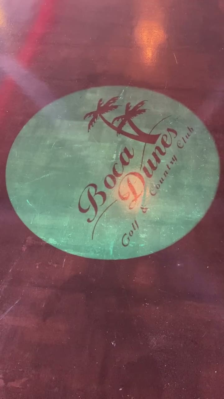Custom gobo logo projected onto a country club dance floor — event and wedding monogram projector in action — Infinity Projectors