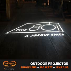 Video: white line-art venue logo gobo projected across dark wood flooring at an event space