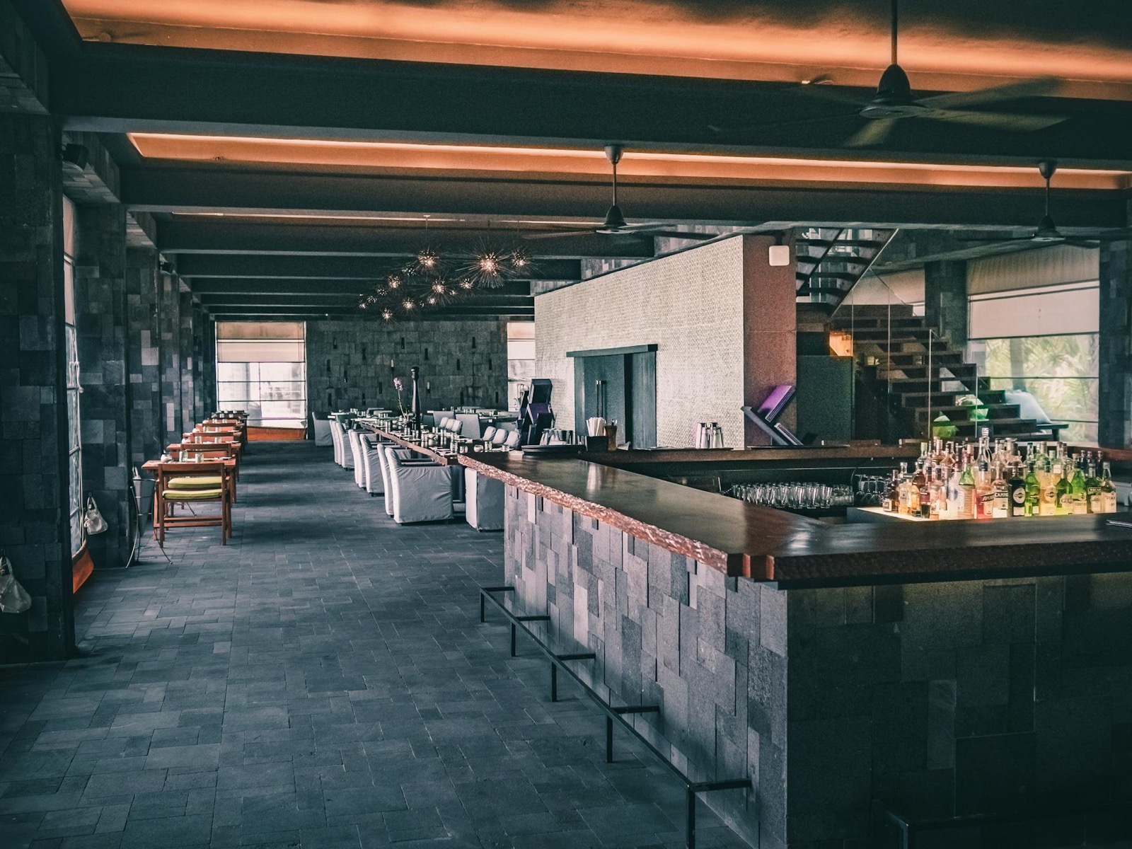 Stone-walled bar interior — an example venue for custom gobo logo projection | Infinity Projectors
