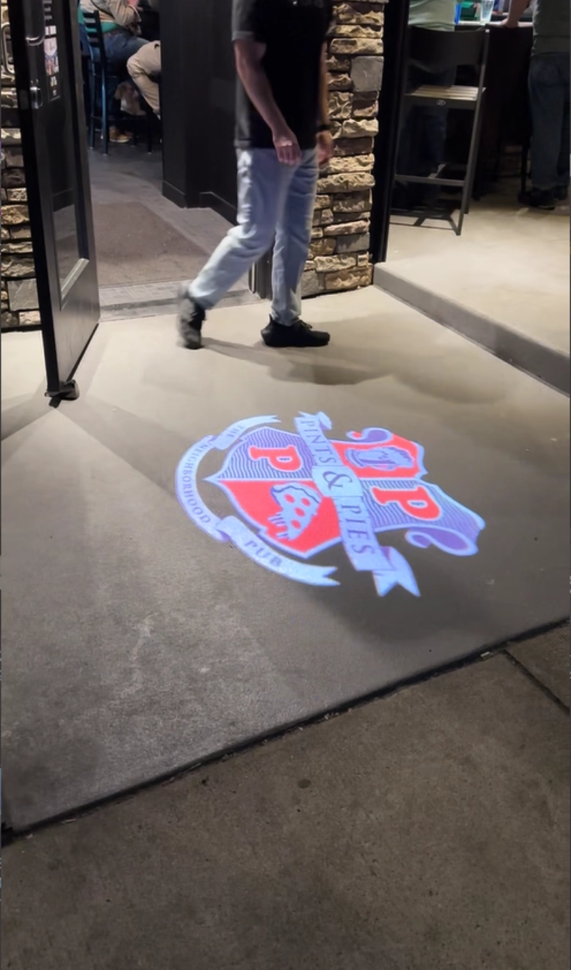 real outdoor photo with character projected on ground — Infinity Projectors
