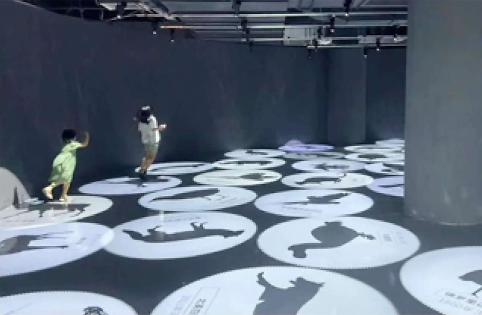 Real Kids Playing Museum Floor Game logo gobo projection — real Schools & Education install | Infinity Projectors — Infinity Projectors