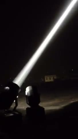 7000W sky beam searchlight cutting into the night sky — Infinity Projectors outdoor searchlight