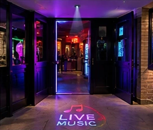 Nightclub entrance with LIVE MUSIC and music notes projected on the floor under neon — Infinity Projectors