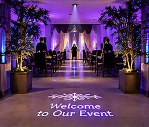 Event room lit purple with Welcome to Our Event projected on the floor at the entrance — Infinity Projectors