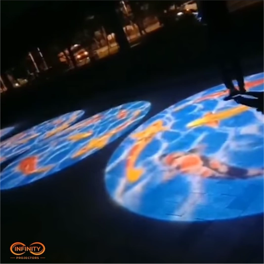 real photo of colorful circles projected outdoors at night — Infinity Projectors