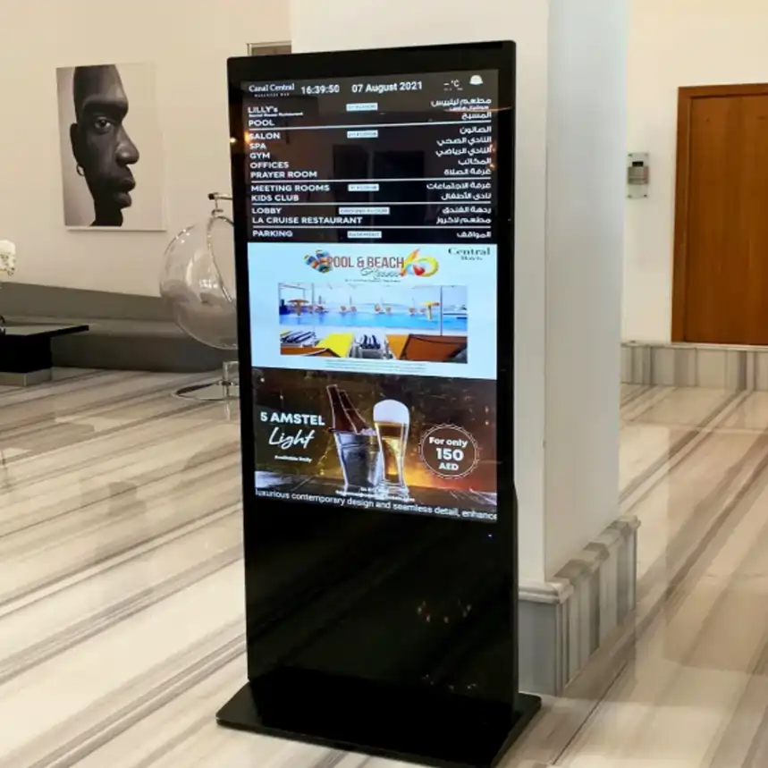 Interactive Floorstanding Touchscreen Kiosks — Real estate logo gobo projection for property branding — cast in light by a custom gobo projector — Infinity Projectors
