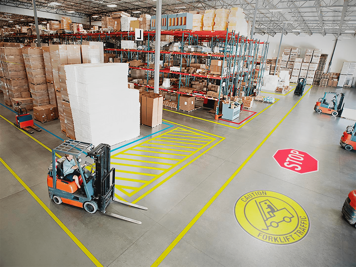 real photo of warehouse floor with projected shapes and forklift — Infinity Projectors