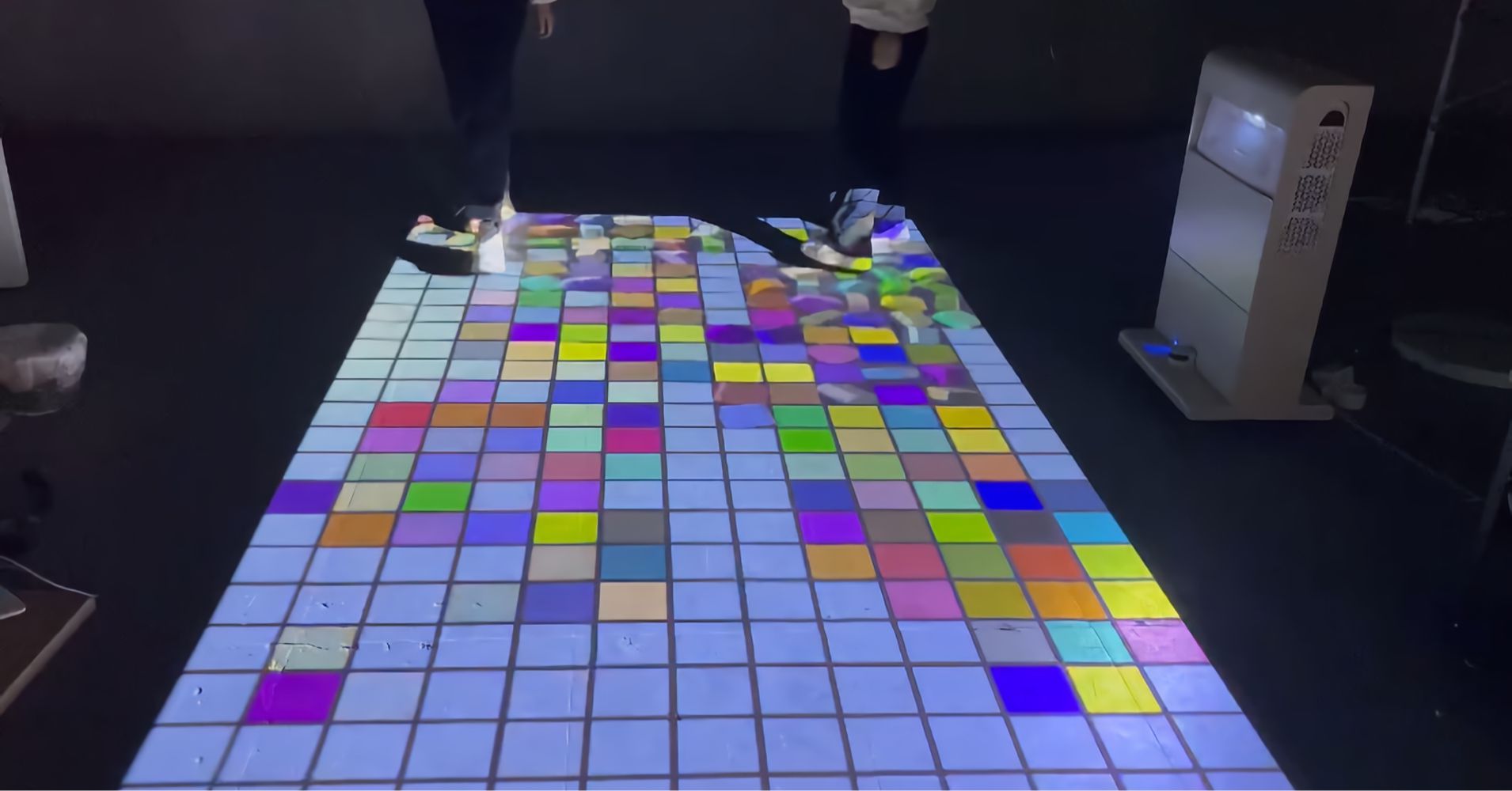 Infinity Mobile Laser Interactive Floor Projector Tower — real use, person playing interactive floor game