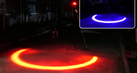 Red and blue LED arcs projected on the ground by the U-shaped boundary light — Infinity Projectors