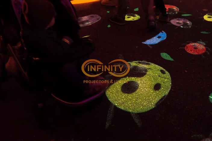 real dim photo of colorful shapes on ground with watermark