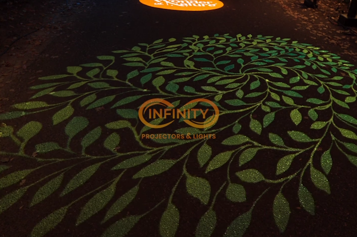 Video: leafy green swirl gobo covers a walkway with an orange spotlight glowing beyond