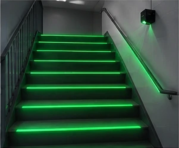 Green tread lighting projected across a staircase — Infinity Projectors