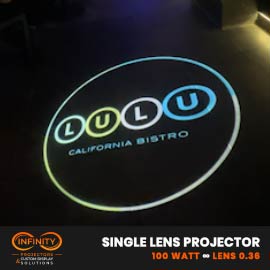 Video: colorful bistro logo circle projected on a dark restaurant floor