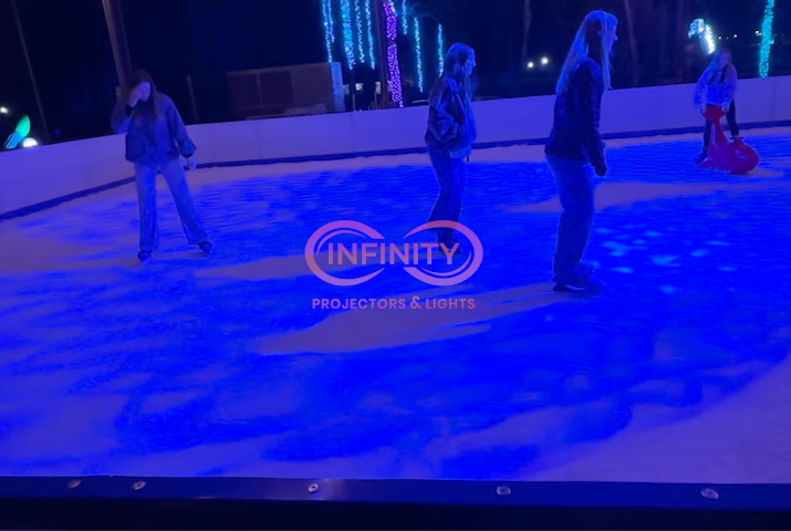 real photo of people ice skating with blue lighting — Infinity Projectors