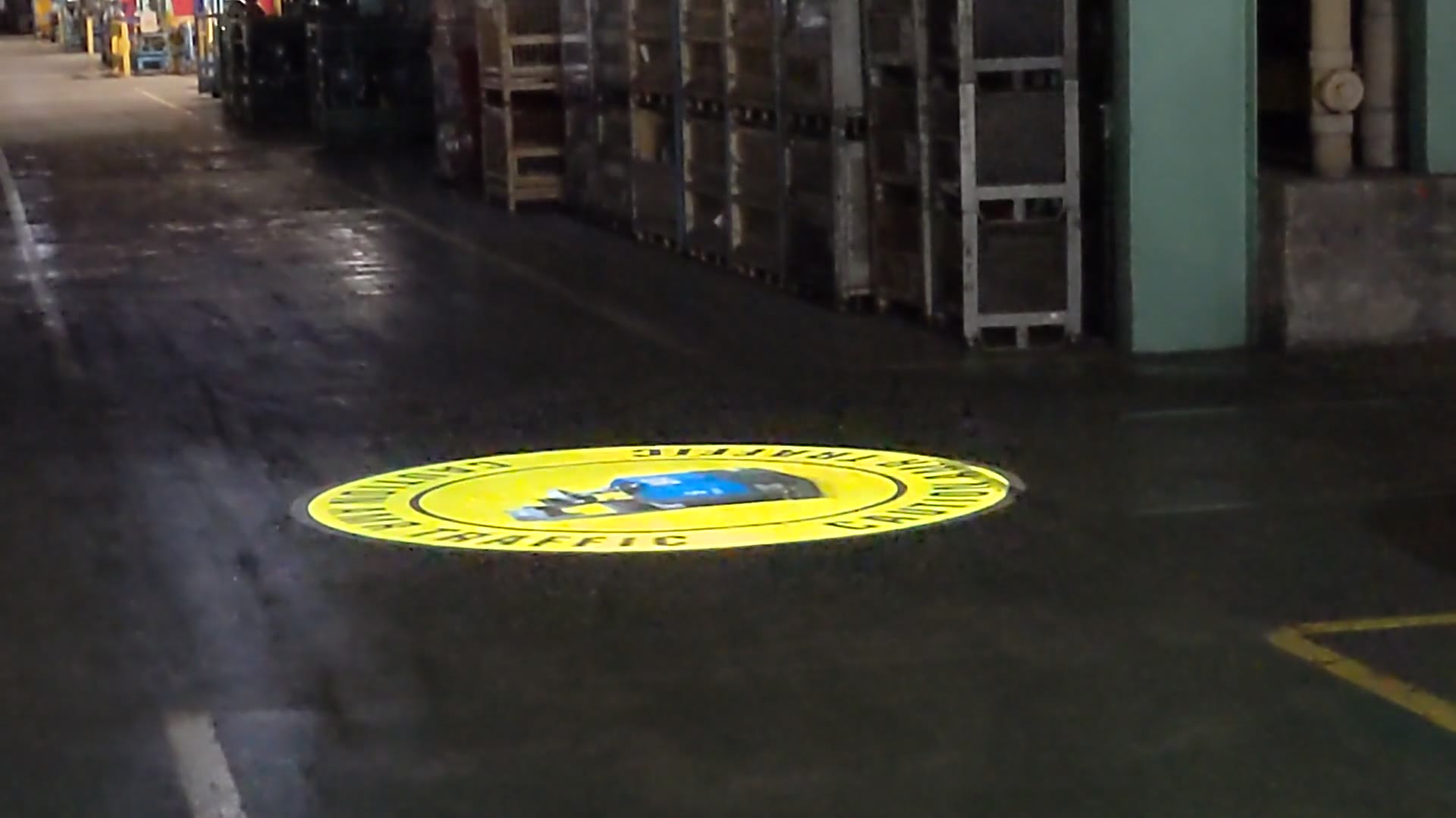 Video of a caution forklift traffic floor projection in a real warehouse and factory aisle at KTH Parts Industries — Infinity Projectors