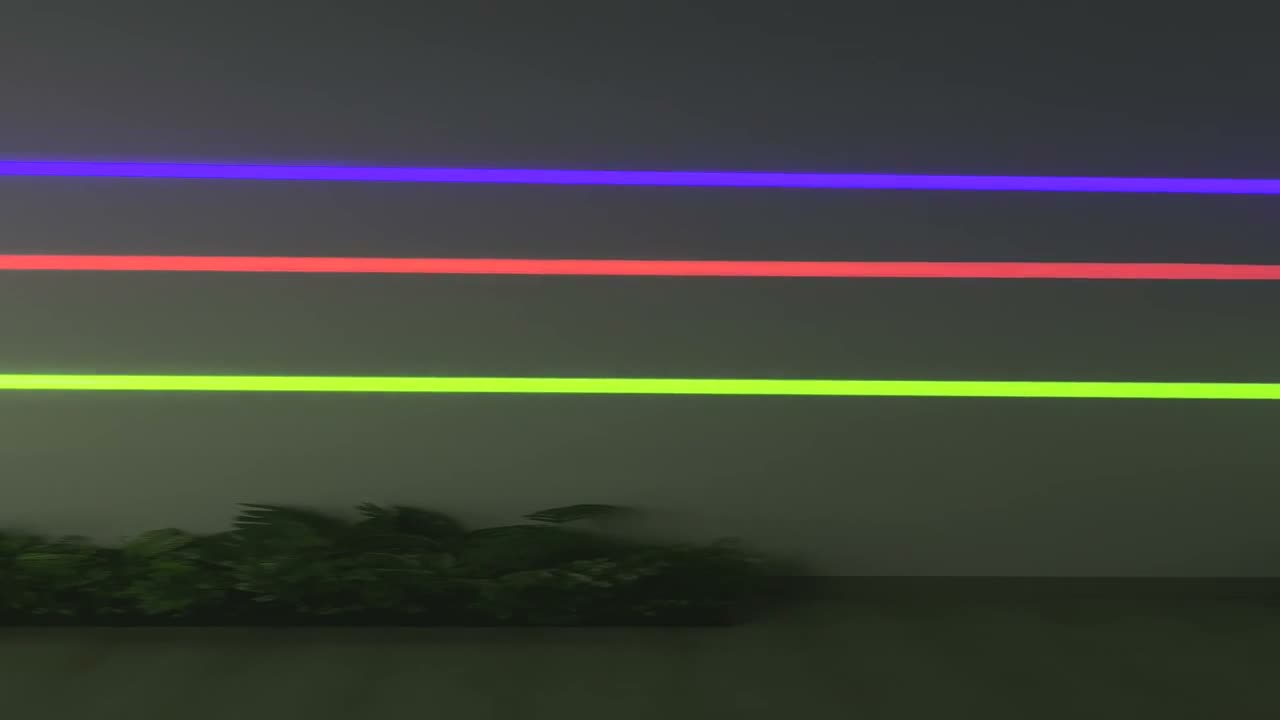 Green, red, and blue laser lines projected across an outdoor landscaped area at night, demonstrating long-throw visibility — Infinity Projectors