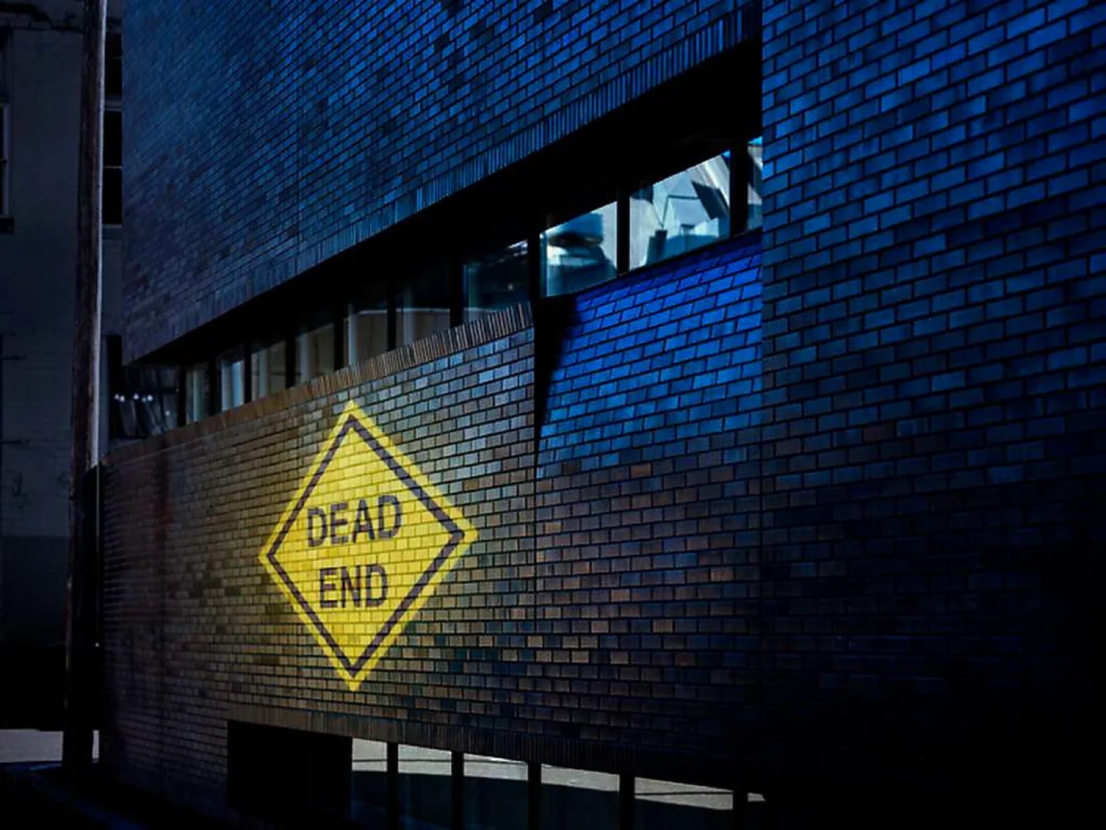 Real Dead End Sign Brick Wall Projection logo gobo projection — real Business & Branding install | Infinity Projectors — Infinity Projectors