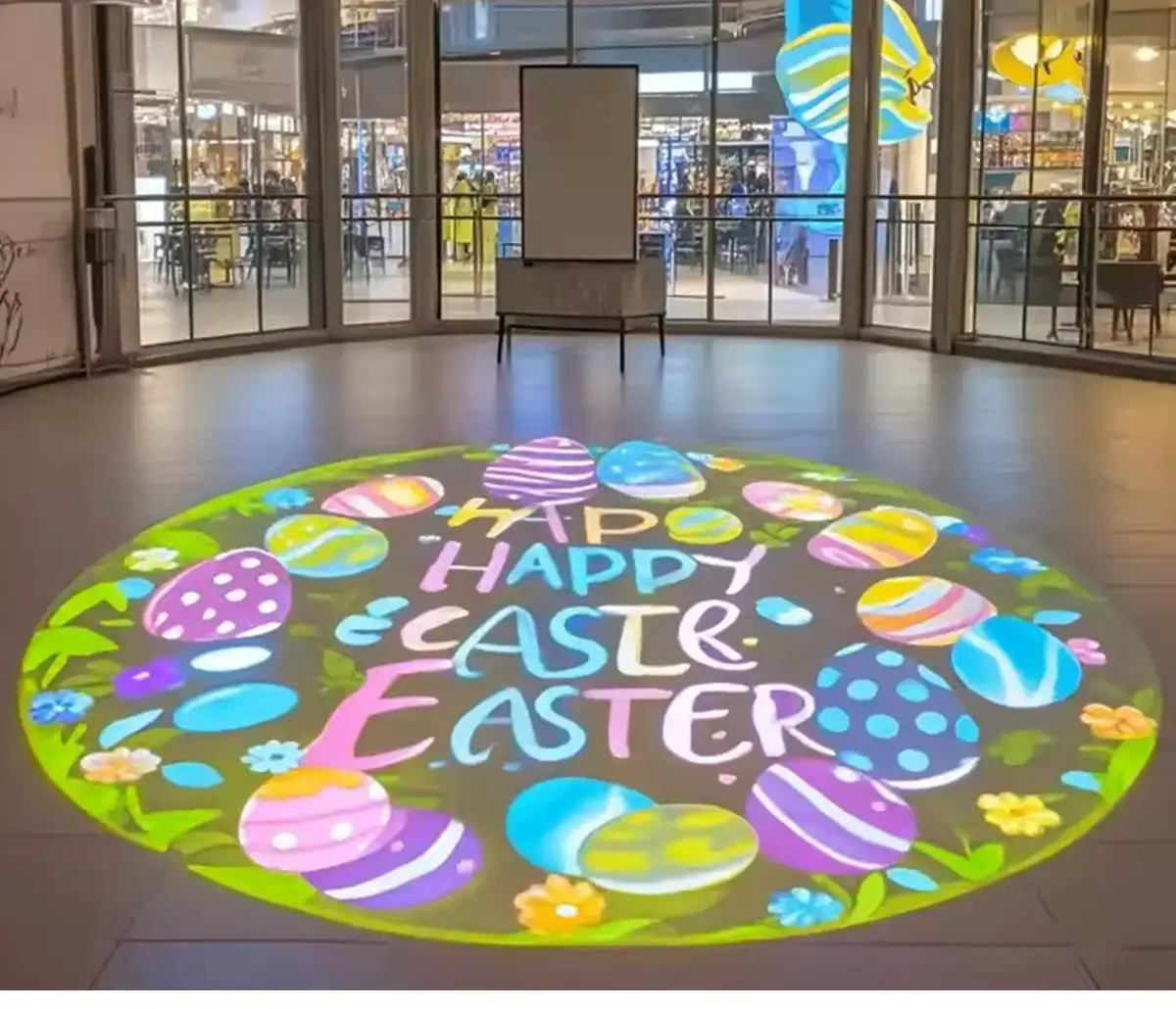 Real Easter Egg Mall Atrium Crop logo gobo projection — real Retail & Storefronts install | Infinity Projectors — Infinity Projectors
