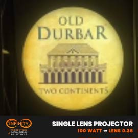 Video: warm circular restaurant emblem with a columned building glowing on a dark wall
