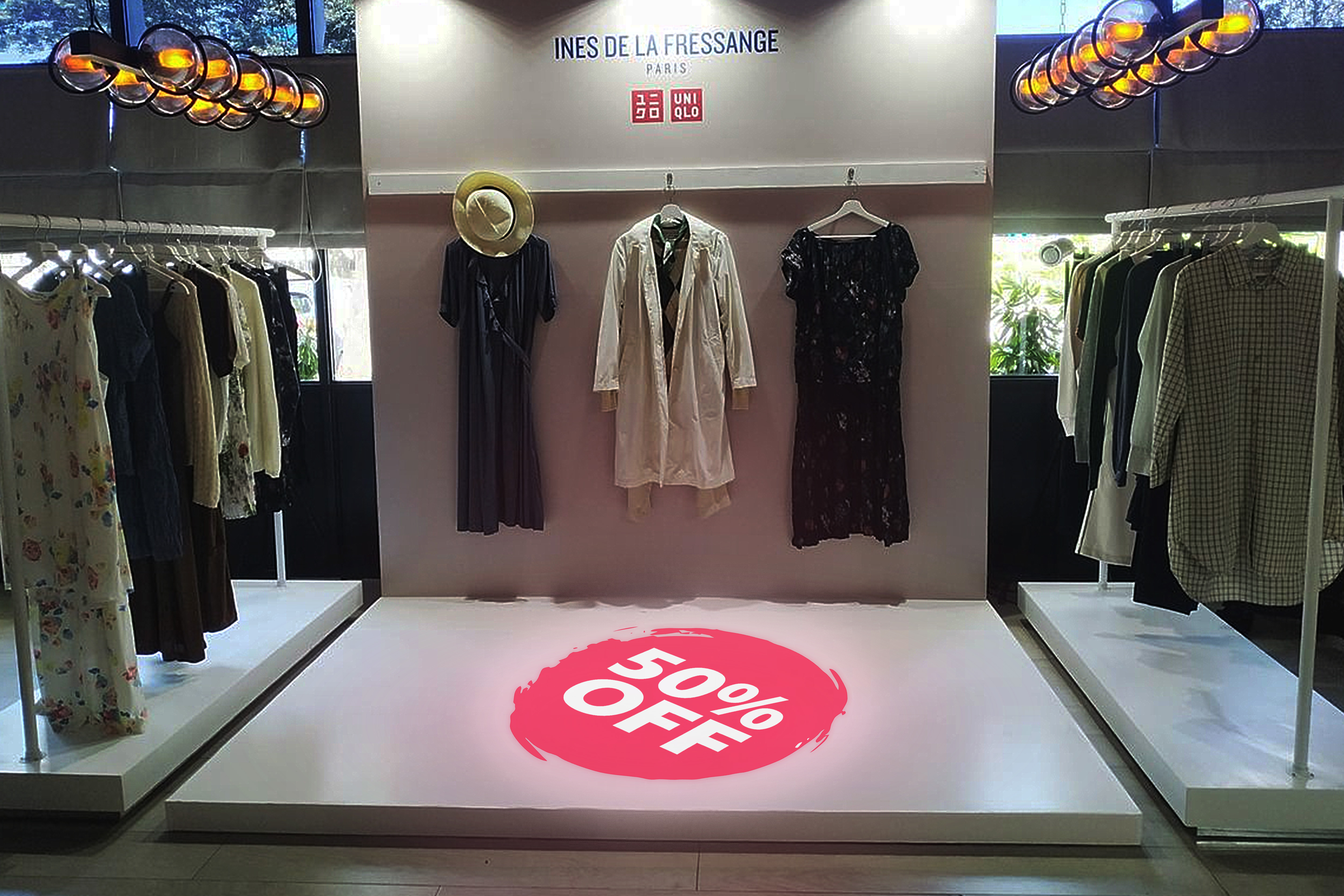 Real photo of 50% off projected on store floor — Infinity Projectors