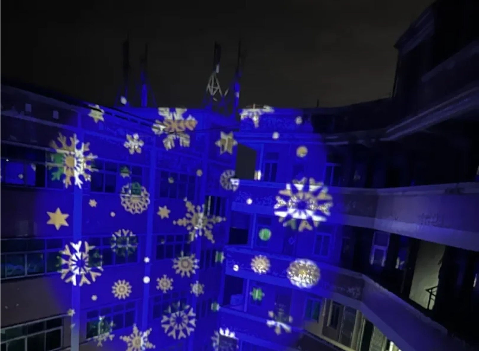 Real Holiday Snowflake Courtyard Projection logo gobo projection — real Events & Festivals install | Infinity Projectors — Infinity Projectors