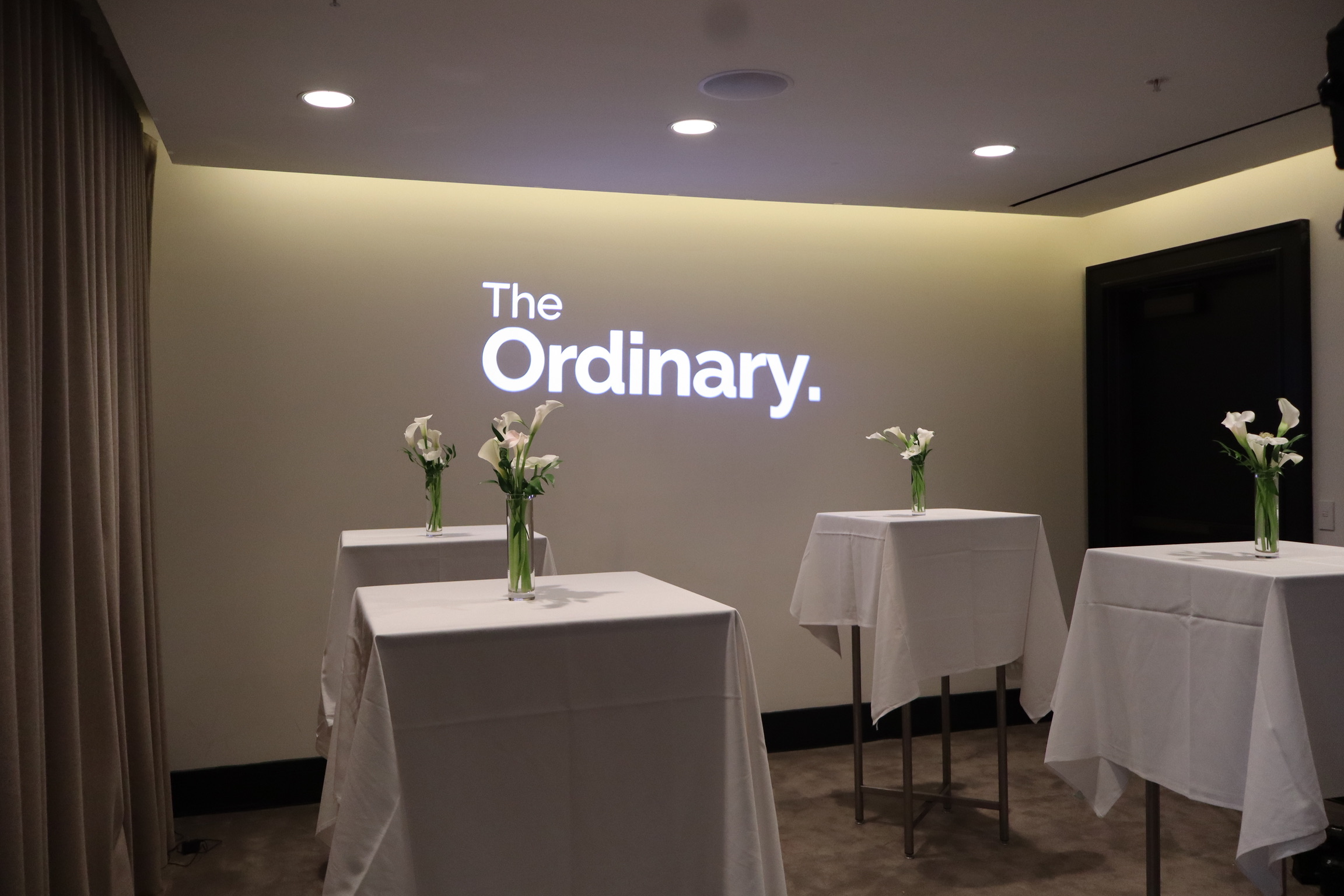 The Ordinary logo projected on a wall at an Estée Lauder Companies brand activation event — Infinity Projectors