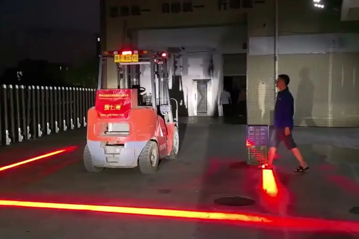 Forklift safety zone line turned red as a warehouse worker walks toward the truck — Infinity Projectors